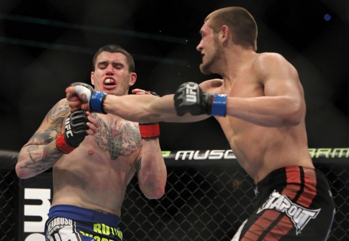 CHICAGO, IL - JANUARY 28: (R-L) Dustin Jacoby punches Chris Camozzi during the UFC on FOX event at United Center on January 28, 2012 in Chicago, Illinois. (Photo by Josh Hedges/Zuffa LLC/Zuffa LLC via Getty Images) *** Local Caption *** Chris Camozzi; D