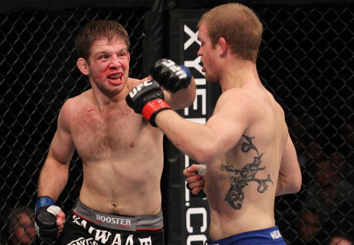 CHICAGO, IL - JANUARY 28: (L-R) Nik Lentz punches Evan Dunham during the UFC on FOX event at United Center on January 28, 2012 in Chicago, Illinois. (Photo by Nick Laham/Zuffa LLC/Zuffa LLC via Getty Images) *** Local Caption *** Nik Lentz; Evan Dunham
