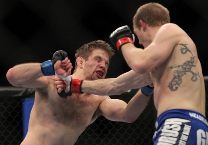 CHICAGO, IL - JANUARY 28: (R-L) Evan Dunham punches Nik Lentz during the UFC on FOX event at United Center on January 28, 2012 in Chicago, Illinois. (Photo by Josh Hedges/Zuffa LLC/Zuffa LLC via Getty Images) *** Local Caption *** Nik Lentz; Evan Dunham