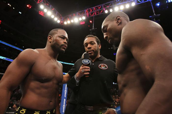 CHICAGO, IL - JANUARY 28: (L-R) Light Heavyweight opponents Rashad Evans and Phil Davis receive final instructions from referee Herb Dean before their bout during the UFC on FOX event at United Center on January 28, 2012 in Chicago, Illinois. (Photo by