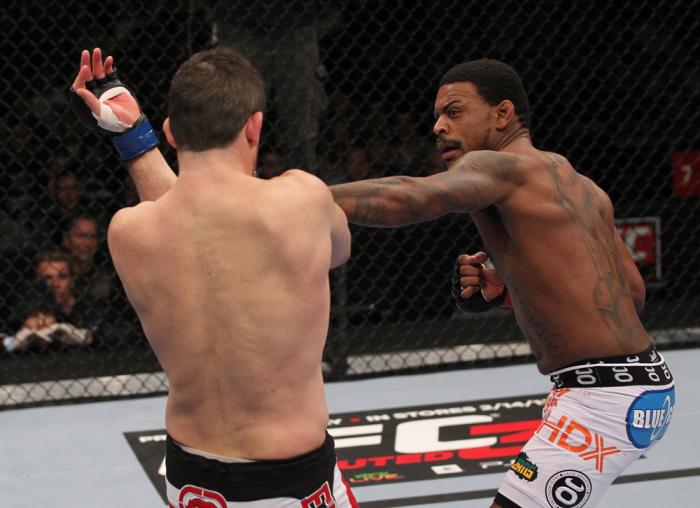 CHICAGO, IL - JANUARY 28: (R-L) Michael Johnson punches Shane Roller during the UFC on FOX event at United Center on January 28, 2012 in Chicago, Illinois. (Photo by Nick Laham/Zuffa LLC/Zuffa LLC via Getty Images) *** Local Caption *** Michael Johnson;