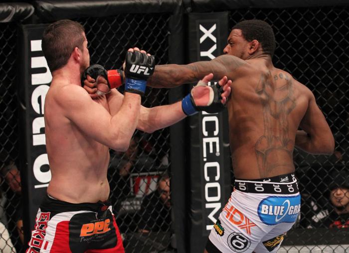 CHICAGO, IL - JANUARY 28: (R-L) Michael Johnson punches Shane Roller during the UFC on FOX event at United Center on January 28, 2012 in Chicago, Illinois. (Photo by Nick Laham/Zuffa LLC/Zuffa LLC via Getty Images) *** Local Caption *** Michael Johnson;