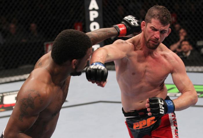 CHICAGO, IL - JANUARY 28: (L-R) Michael Johnson and Shane Roller trade punches during the UFC on FOX event at United Center on January 28, 2012 in Chicago, Illinois. (Photo by Nick Laham/Zuffa LLC/Zuffa LLC via Getty Images) *** Local Caption *** Michae