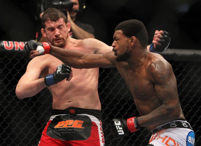 CHICAGO, IL - JANUARY 28: (R-L) Michael Johnson and Shane Roller trade punches during the UFC on FOX event at United Center on January 28, 2012 in Chicago, Illinois. (Photo by Josh Hedges/Zuffa LLC/Zuffa LLC via Getty Images) *** Local Caption *** Micha