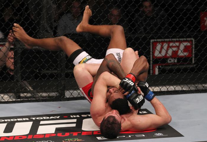 CHICAGO, IL - JANUARY 28: (L-R) Shane Roller attempts a rear choke submission against Michael Johnson during the UFC on FOX event at United Center on January 28, 2012 in Chicago, Illinois. (Photo by Nick Laham/Zuffa LLC/Zuffa LLC via Getty Images) *** L