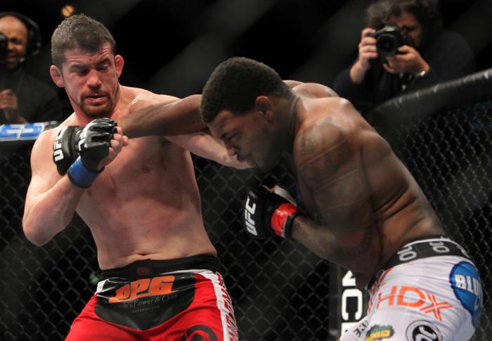 CHICAGO, IL - JANUARY 28: (R-L) Michael Johnson and Shane Roller trade punches during the UFC on FOX event at United Center on January 28, 2012 in Chicago, Illinois. (Photo by Josh Hedges/Zuffa LLC/Zuffa LLC via Getty Images) *** Local Caption *** Micha