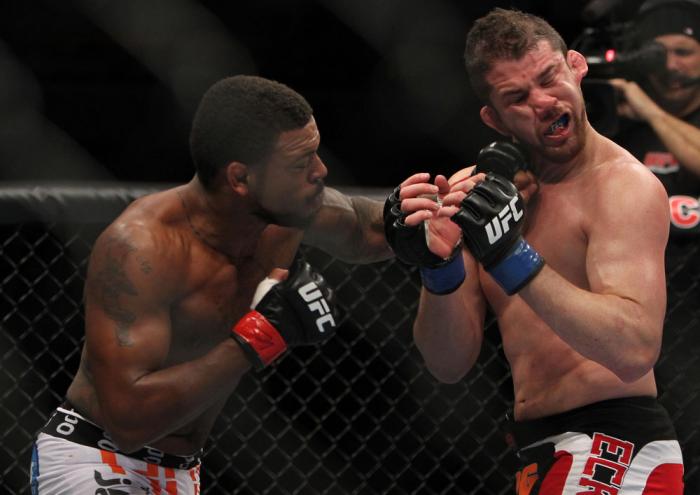 CHICAGO, IL - JANUARY 28: (L-R) Michael Johnson punches Shane Roller during the UFC on FOX event at United Center on January 28, 2012 in Chicago, Illinois. (Photo by Josh Hedges/Zuffa LLC/Zuffa LLC via Getty Images) *** Local Caption *** Michael Johnson