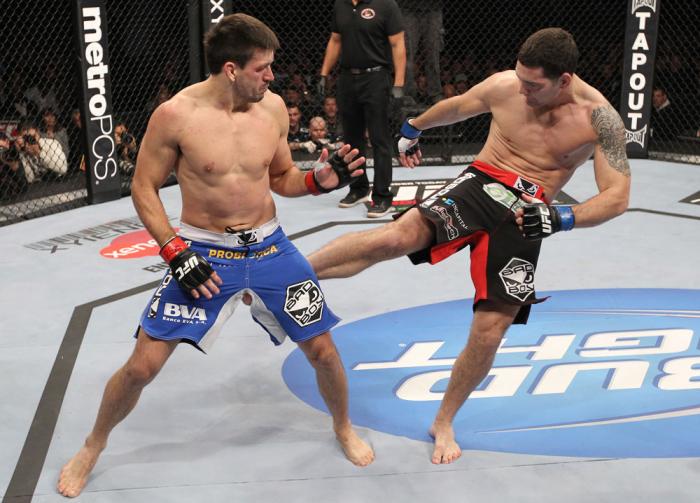 CHICAGO, IL - JANUARY 28: (R-L) Chris Weidman kicks Demian Maia during the UFC on FOX event at United Center on January 28, 2012 in Chicago, Illinois. (Photo by Nick Laham/Zuffa LLC/Zuffa LLC via Getty Images) *** Local Caption *** Chris Weidman; Demian