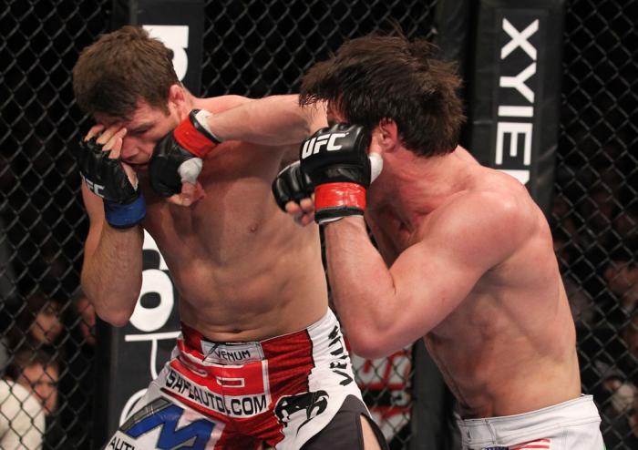 CHICAGO, IL - JANUARY 28: (R-L) Chael Sonnen punches Michael Bisping during the UFC on FOX event at United Center on January 28, 2012 in Chicago, Illinois. (Photo by Nick Laham/Zuffa LLC/Zuffa LLC via Getty Images) *** Local Caption *** Chael Sonnen; Mi