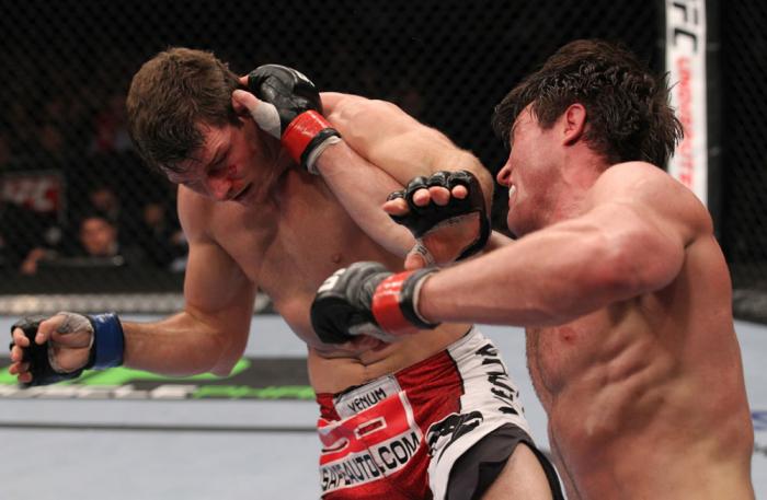 CHICAGO, IL - JANUARY 28: (R-L) Chael Sonnen punches Michael Bisping during the UFC on FOX event at United Center on January 28, 2012 in Chicago, Illinois. (Photo by Nick Laham/Zuffa LLC/Zuffa LLC via Getty Images) *** Local Caption *** Chael Sonnen; Mi