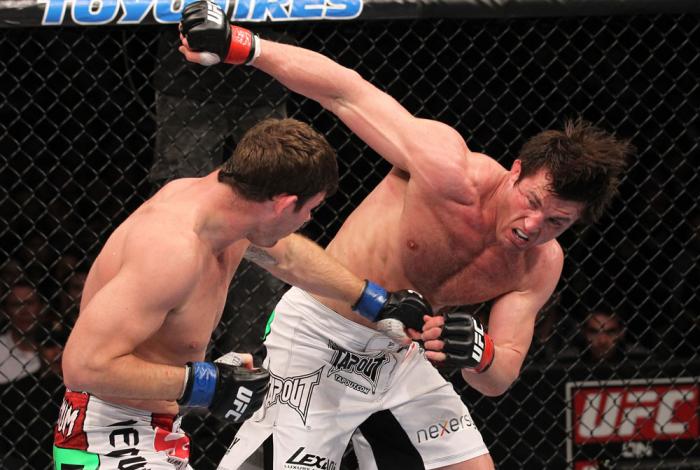 CHICAGO, IL - JANUARY 28: (R-L) Chael Sonnen and Michael Bisping trade punches during the UFC on FOX event at United Center on January 28, 2012 in Chicago, Illinois. (Photo by Nick Laham/Zuffa LLC/Zuffa LLC via Getty Images) *** Local Caption *** Chael