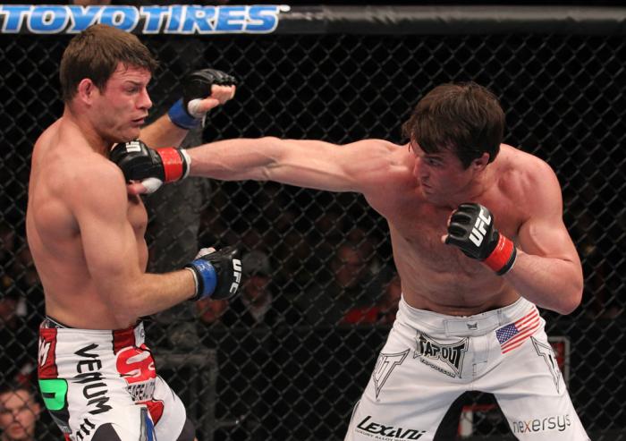 CHICAGO, IL - JANUARY 28: (R-L) Chael Sonnen punches Michael Bisping during the UFC on FOX event at United Center on January 28, 2012 in Chicago, Illinois. (Photo by Nick Laham/Zuffa LLC/Zuffa LLC via Getty Images) *** Local Caption *** Chael Sonnen; Mi
