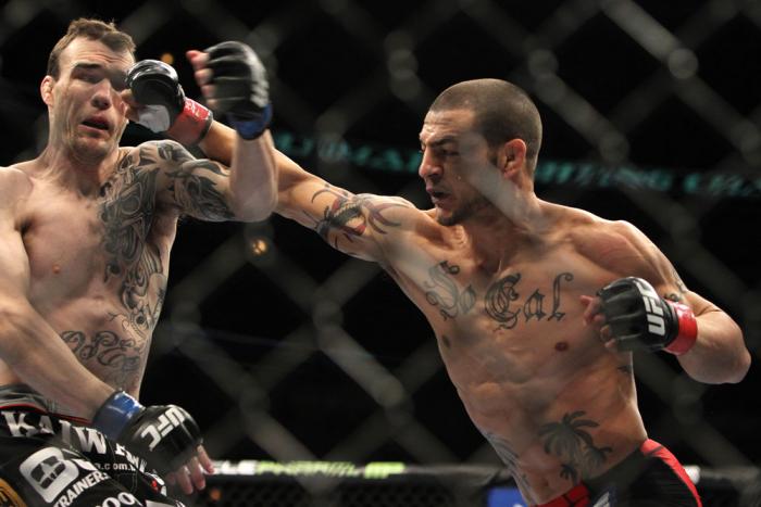 CHICAGO, IL - JANUARY 28: (L-R) George Roop and Cub Swanson trade punches during the UFC on FOX event at United Center on January 28, 2012 in Chicago, Illinois. (Photo by Josh Hedges/Zuffa LLC/Zuffa LLC via Getty Images) *** Local Caption *** Cub Swanso