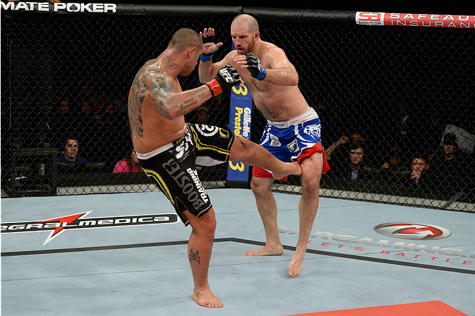 BARUERI, BRAZIL - OCTOBER 9: (L-R) Thiago Silva kicks Matt Hamill in their light heavyweight bout during the UFC Fight Night event at the Ginasio Jose Correa on October 9, 2013 in Barueri, Sao Paulo, Brazil. (Photo by Jeff Bottari/Zuffa LLC/Zuffa LLC via