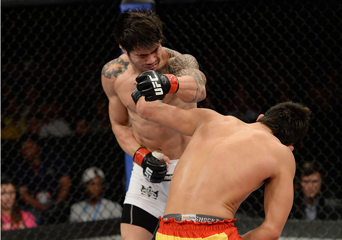 BARUERI, BRAZIL - OCTOBER 9: (R-L) Dong Hyun Kim knocks out Erick Silva in their welterweight bout during the UFC Fight Night event at the Ginasio Jose Correa on October 9, 2013 in Barueri, Sao Paulo, Brazil. (Photo by Jeff Bottari/Zuffa LLC/Zuffa LLC vi