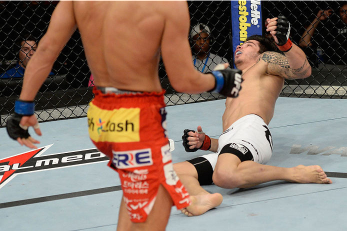 BARUERI, BRAZIL - OCTOBER 9: (R-L) Erick Silva gets knocked out by Dong Hyun Kim in their welterweight bout during the UFC Fight Night event at the Ginasio Jose Correa on October 9, 2013 in Barueri, Sao Paulo, Brazil. (Photo by Jeff Bottari/Zuffa LLC/Zuf