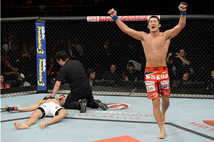 BARUERI, BRAZIL - OCTOBER 9: (R-L) Dong Hyun Kim celebrates after knocking out Erick Silva in their welterweight bout during the UFC Fight Night event at the Ginasio Jose Correa on October 9, 2013 in Barueri, Sao Paulo, Brazil. (Photo by Jeff Bottari/Zuf