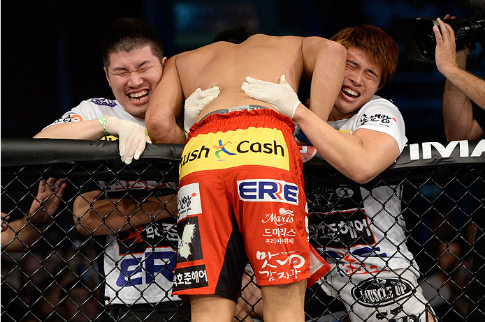 BARUERI, BRAZIL - OCTOBER 9: Dong Hyun Kim celebrates with his corner after knocking out Erick Silva (not pictured) in their welterweight bout during the UFC Fight Night event at the Ginasio Jose Correa on October 9, 2013 in Barueri, Sao Paulo, Brazil. (