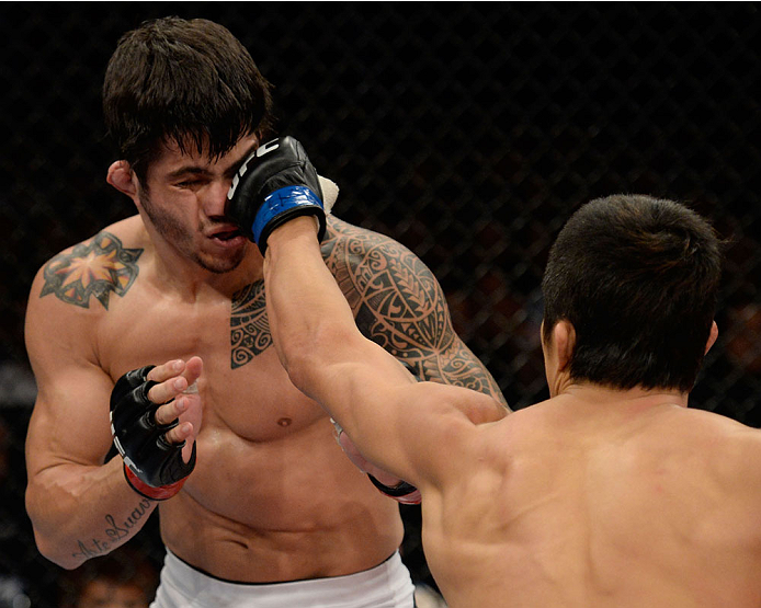 BARUERI, BRAZIL - OCTOBER 9: (R-L) Dong Hyun Kim punches Erick Silva in their welterweight bout during the UFC Fight Night event at the Ginasio Jose Correa on October 9, 2013 in Barueri, Sao Paulo, Brazil. (Photo by Jeff Bottari/Zuffa LLC/Zuffa LLC via G