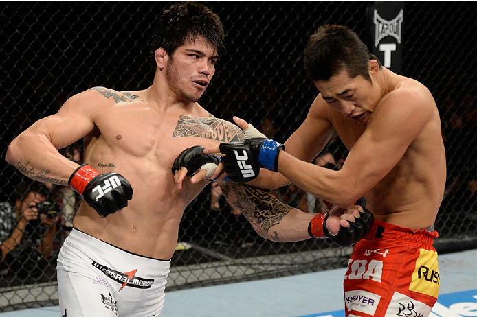 BARUERI, BRAZIL - OCTOBER 9: (L-R) Erick Silva punches Dong Hyun Kim in their welterweight bout during the UFC Fight Night event at the Ginasio Jose Correa on October 9, 2013 in Barueri, Sao Paulo, Brazil. (Photo by Jeff Bottari/Zuffa LLC/Zuffa LLC via G