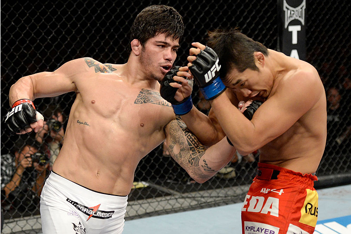 BARUERI, BRAZIL - OCTOBER 9: (L-R) Erick Silva punches Dong Hyun Kim in their welterweight bout during the UFC Fight Night event at the Ginasio Jose Correa on October 9, 2013 in Barueri, Sao Paulo, Brazil. (Photo by Jeff Bottari/Zuffa LLC/Zuffa LLC via G