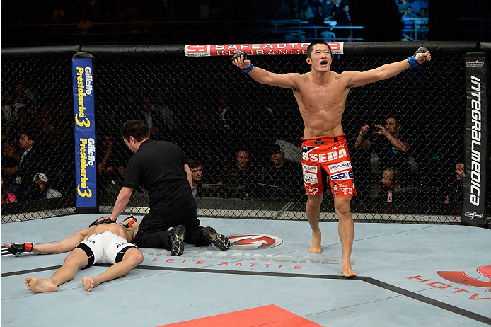 BARUERI, BRAZIL - OCTOBER 9: (R-L) Dong Hyun Kim celebrates after knocking out Erick Silva in their welterweight bout during the UFC Fight Night event at the Ginasio Jose Correa on October 9, 2013 in Barueri, Sao Paulo, Brazil. (Photo by Jeff Bottari/Zuf