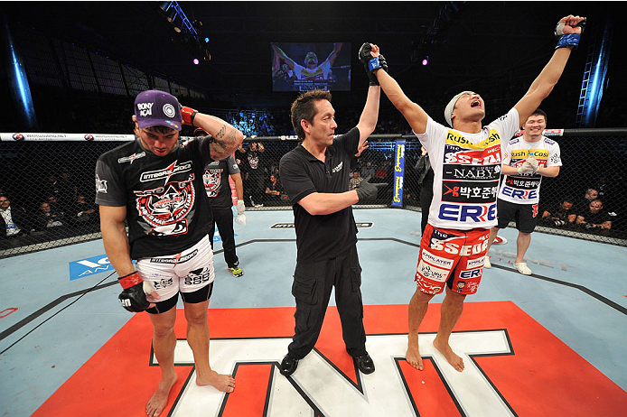 BARUERI, BRAZIL - OCTOBER 9: (R-L) Dong Hyun Kim celebrates after defeating Erick Silva by knockout in their welterweight bout during the UFC Fight Night event at the Ginasio Jose Correa on October 9, 2013 in Barueri, Sao Paulo, Brazil. (Photo by Jeff Bo
