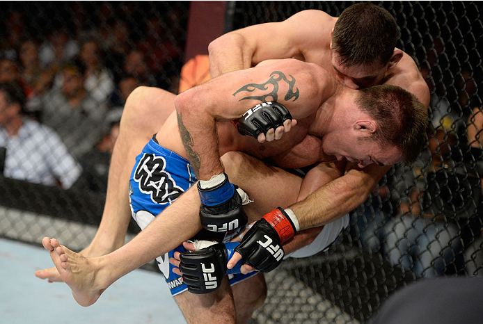 BARUERI, BRAZIL - OCTOBER 9: Demian Maia (white shorts) jumps on Jake Shields (blue shorts) in their welterweight bout during the UFC Fight Night event at the Ginasio Jose Correa on October 9, 2013 in Barueri, Sao Paulo, Brazil. (Photo by Jeff Bottari/Zu