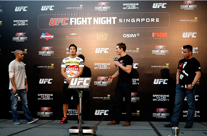 SINGAPORE - JANUARY 03: (L to R) Jon Anik, Dong Hyun Kim, John Hathaway and Cung Le during the UFC Fight Night Singapore Q&A at the Shoppes at Marina Bay Sands on January 3, 2014 in Singapore. (Photo by Mitch Viquez/Zuffa LLC/Zuffa LLC via Getty Images)