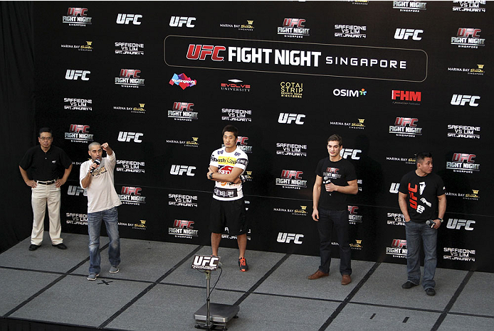 SINGAPORE - JANUARY 03: (L to R) Jon Anik, Dong Hyun Kim, John Hathaway and Cung Le during the UFC Fight Night Singapore Q&A at the Shoppes at Marina Bay Sands on January 3, 2014 in Singapore. (Photo by Mitch Viquez/Zuffa LLC/Zuffa LLC via Getty Images)