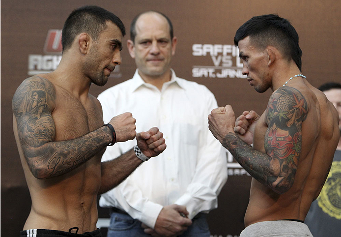 SINGAPORE - JANUARY 03: (L and R) Leandro Issa and Russell Doane face off during the UFC Fight Night Singapore Weigh-in at the Shoppes at Marina Bay Sands on January 3, 2014 in Singapore. (Photo by Mitch Viquez/Zuffa LLC/Zuffa LLC via Getty Images)