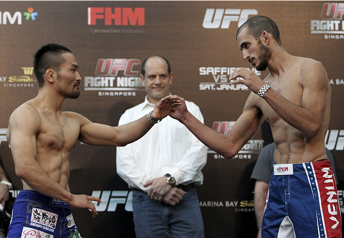 SINGAPORE - JANUARY 03: (L and R) Katsunori Kikuno and Quinn Mulhern during the UFC Fight Night Singapore Weigh-in at the Shoppes at Marina Bay Sands on January 3, 2014 in Singapore. (Photo by Mitch Viquez/Zuffa LLC/Zuffa LLC via Getty Images)