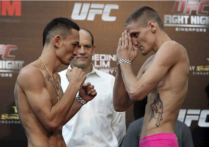 SINGAPORE - JANUARY 03: (L and R) Max Holloway and Will Chope face off during the UFC Fight Night Singapore Weigh-in at the Shoppes at Marina Bay Sands on January 3, 2014 in Singapore. (Photo by Mitch Viquez/Zuffa LLC/Zuffa LLC via Getty Images)