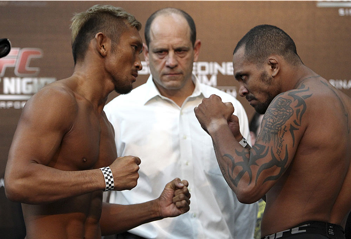 SINGAPORE - JANUARY 03: (L and R) Kiichi Kunimoto and Luiz Dutra face off during the UFC Fight Night Singapore Weigh-in at the Shoppes at Marina Bay Sands on January 3, 2014 in Singapore. (Photo by Mitch Viquez/Zuffa LLC/Zuffa LLC via Getty Images)