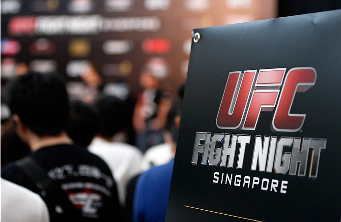 SINGAPORE - JANUARY 03: Fans look on during the UFC Fight Night Singapore Weigh-in at the Shoppes at Marina Bay Sands on January 3, 2014 in Singapore. (Photo by Josh Hedges/Zuffa LLC/Zuffa LLC via Getty Images)