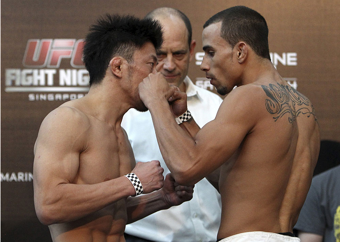 SINGAPORE - JANUARY 03: (L and R) Tatsuya Kawajiri and Sean Soriano face off during the UFC Fight Night Singapore Weigh-in at the Shoppes at Marina Bay Sands on January 3, 2014 in Singapore. (Photo by Mitch Viquez/Zuffa LLC/Zuffa LLC via Getty Images)