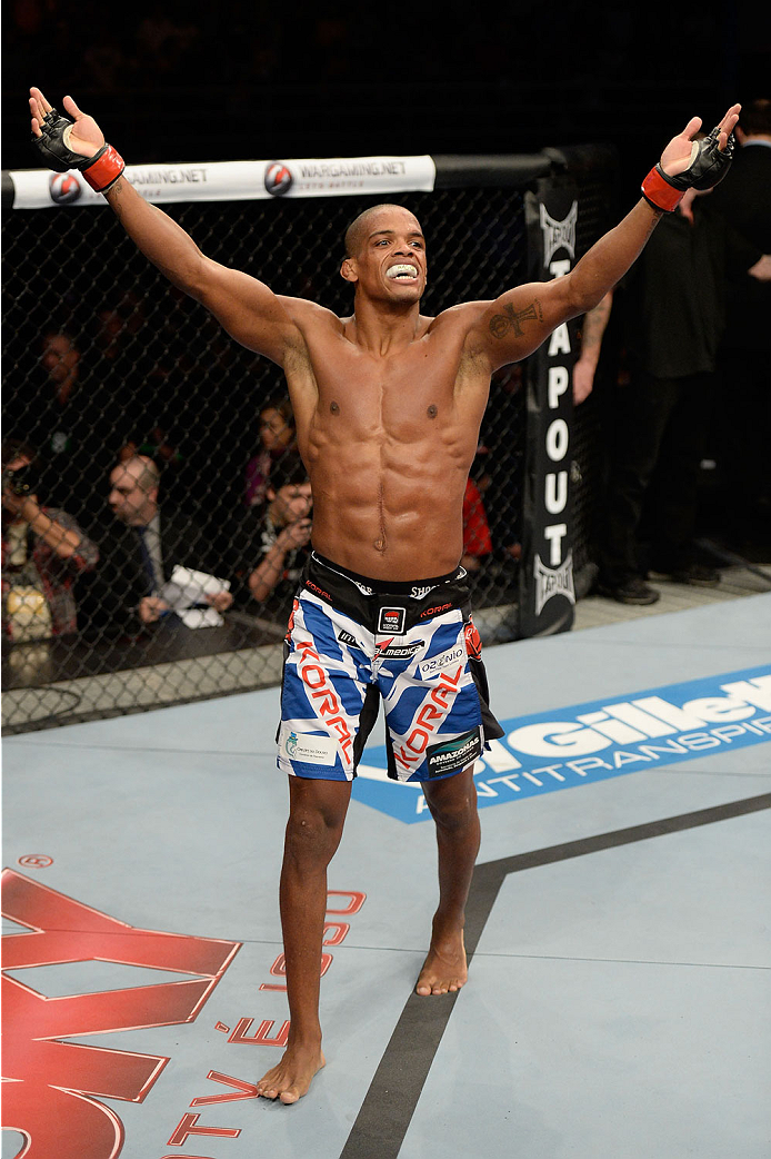 BARUERI, BRAZIL - OCTOBER 9: Alan Patrick celebrates after defeating Garett Whiteley (not pictured) in their lightweight bout during the UFC Fight Night event at the Ginasio Jose Correa on October 9, 2013 in Barueri, Sao Paulo, Brazil. (Photo by Jeff Bot