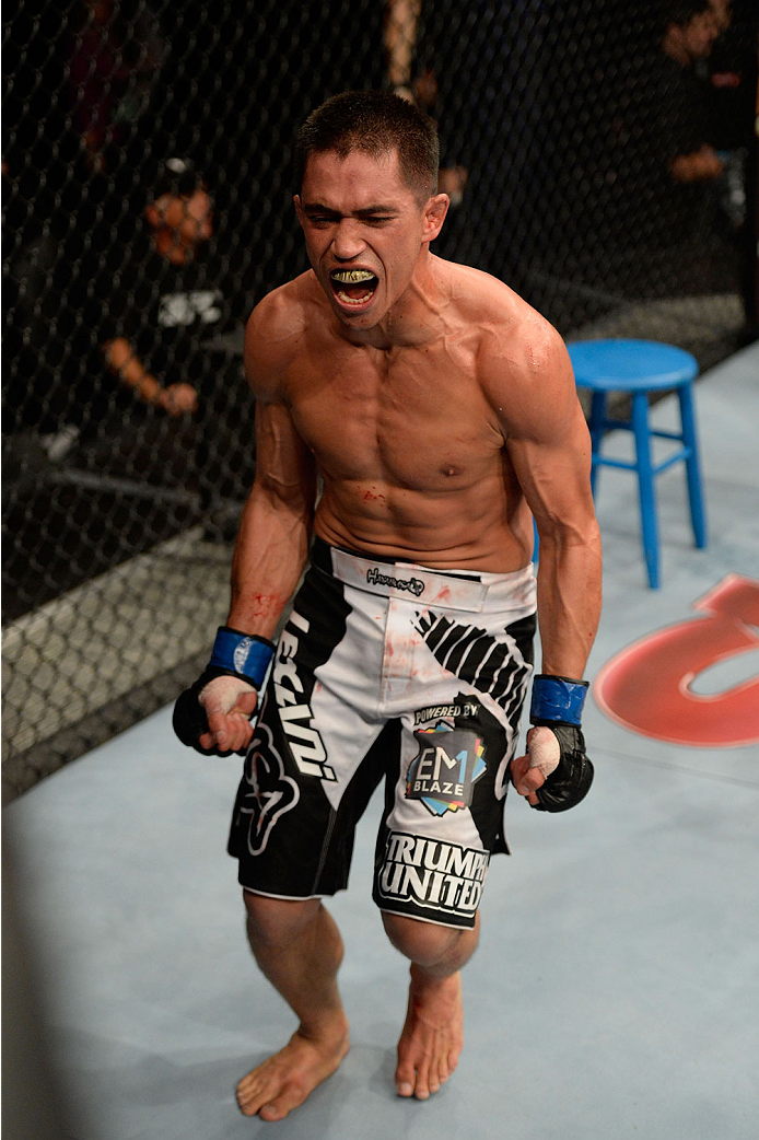 BARUERI, BRAZIL - OCTOBER 9: Chris Cariaso celebrates after defeating Iliarde Santos (not pictured) in their flyweight bout during the UFC Fight Night event at the Ginasio Jose Correa on October 9, 2013 in Barueri, Sao Paulo, Brazil. (Photo by Jeff Botta