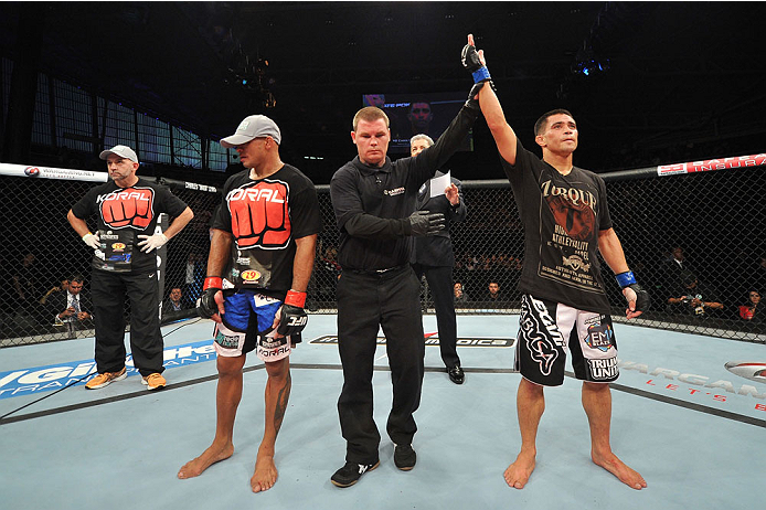 BARUERI, BRAZIL - OCTOBER 9: (R-L) Chris Cariaso celebrates after defeating Iliarde Santos in their flyweight bout during the UFC Fight Night event at the Ginasio Jose Correa on October 9, 2013 in Barueri, Sao Paulo, Brazil. (Photo by Jeff Bottari/Zuffa