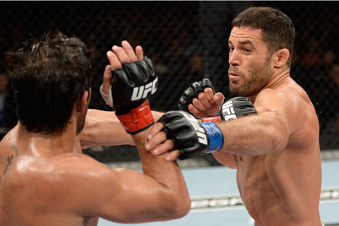 BARUERI, BRAZIL - OCTOBER 9: (R-L) David Mitchell throws a punch at Yan Cabral in their welterweight bout during the UFC Fight Night event at the Ginasio Jose Correa on October 9, 2013 in Barueri, Sao Paulo, Brazil. (Photo by Jeff Bottari/Zuffa LLC/Zuffa