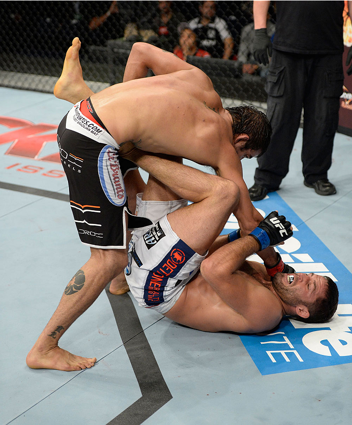 BARUERI, BRAZIL - OCTOBER 9: (L-R) Yan Cabral punches David Mitchell in their welterweight bout during the UFC Fight Night event at the Ginasio Jose Correa on October 9, 2013 in Barueri, Sao Paulo, Brazil. (Photo by Jeff Bottari/Zuffa LLC/Zuffa LLC via G