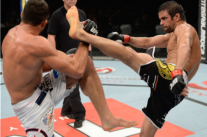 BARUERI, BRAZIL - OCTOBER 9: (R-L) Yan Cabral kicks David Mitchell in their welterweight bout during the UFC Fight Night event at the Ginasio Jose Correa on October 9, 2013 in Barueri, Sao Paulo, Brazil. (Photo by Jeff Bottari/Zuffa LLC/Zuffa LLC via Get