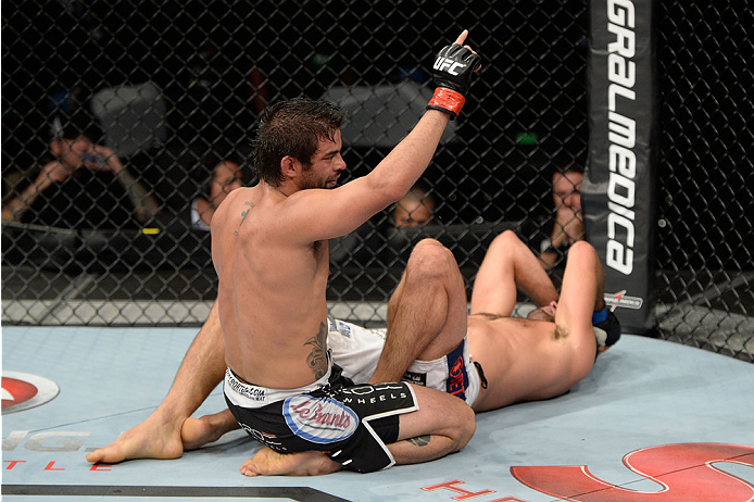 BARUERI, BRAZIL - OCTOBER 9: (L-R) Yan Cabral celebrates after defeating David Mitchell in their welterweight bout during the UFC Fight Night event at the Ginasio Jose Correa on October 9, 2013 in Barueri, Sao Paulo, Brazil. (Photo by Jeff Bottari/Zuffa