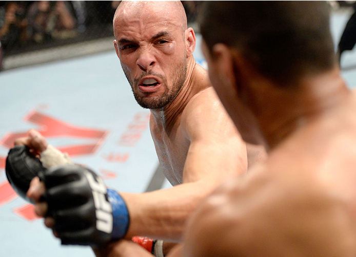 BARUERI, BRAZIL - OCTOBER 9: (L-R) Igor Araujo punches Ildemar Alcantara in their welterweight bout during the UFC Fight Night event at the Ginasio Jose Correa on October 9, 2013 in Barueri, Sao Paulo, Brazil. (Photo by Jeff Bottari/Zuffa LLC/Zuffa LLC v