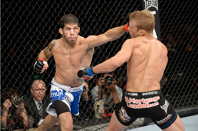 BARUERI, BRAZIL - OCTOBER 9: (L-R) Rafael Assuncao punches TJ Dillashaw in their bantamweight bout during the UFC Fight Night event at the Ginasio Jose Correa on October 9, 2013 in Barueri, Sao Paulo, Brazil. (Photo by Jeff Bottari/Zuffa LLC/Zuffa LLC vi