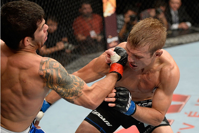 BARUERI, BRAZIL - OCTOBER 9: (L-R) Rafael Assuncao punches TJ Dillashaw in their bantamweight bout during the UFC Fight Night event at the Ginasio Jose Correa on October 9, 2013 in Barueri, Sao Paulo, Brazil. (Photo by Jeff Bottari/Zuffa LLC/Zuffa LLC vi