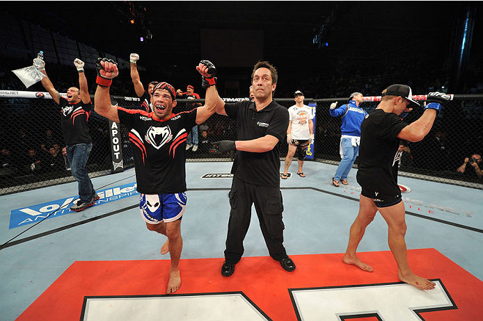 BARUERI, BRAZIL - OCTOBER 9: (L-R) Rafael Assuncao celebrates after defeating TJ Dillashaw in their bantamweight bout during the UFC Fight Night event at the Ginasio Jose Correa on October 9, 2013 in Barueri, Sao Paulo, Brazil. (Photo by Jeff Bottari/Zuf