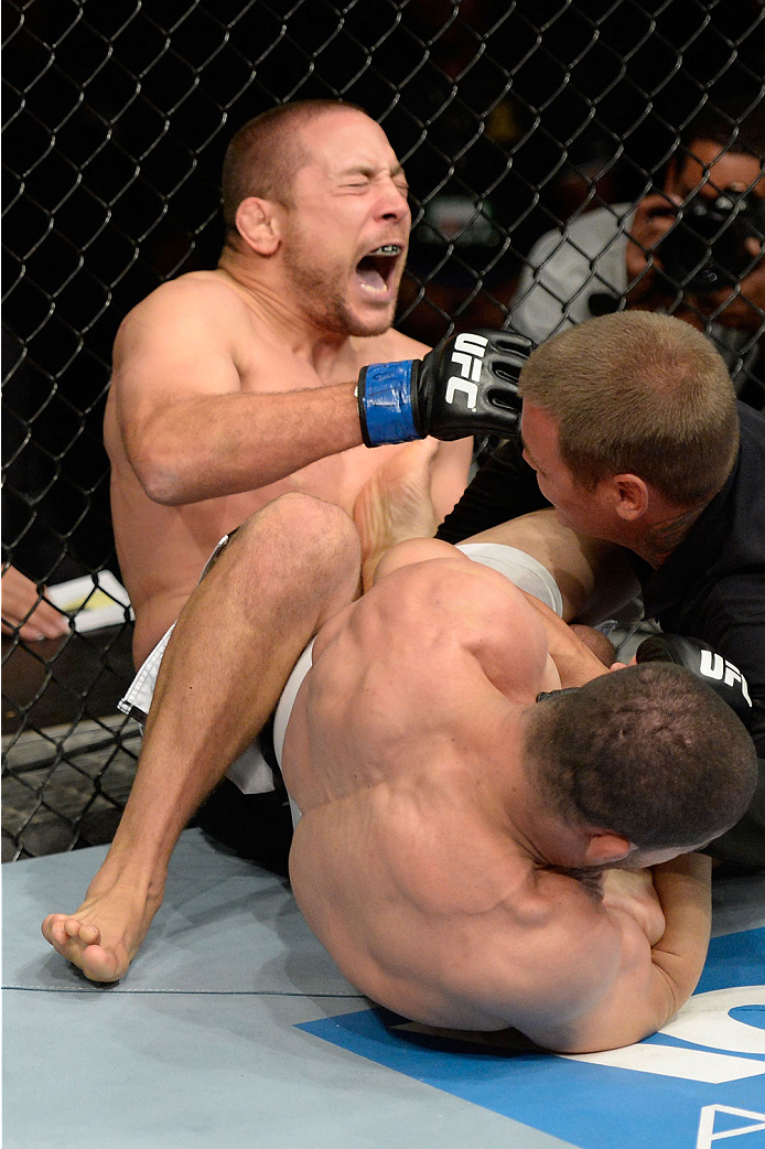 BARUERI, BRAZIL - OCTOBER 9: (L-R) Mike Pierce screams while getting submitted by Rousimar Palhares in their welterweight bout during the UFC Fight Night event at the Ginasio Jose Correa on October 9, 2013 in Barueri, Sao Paulo, Brazil. (Photo by Jeff Bo