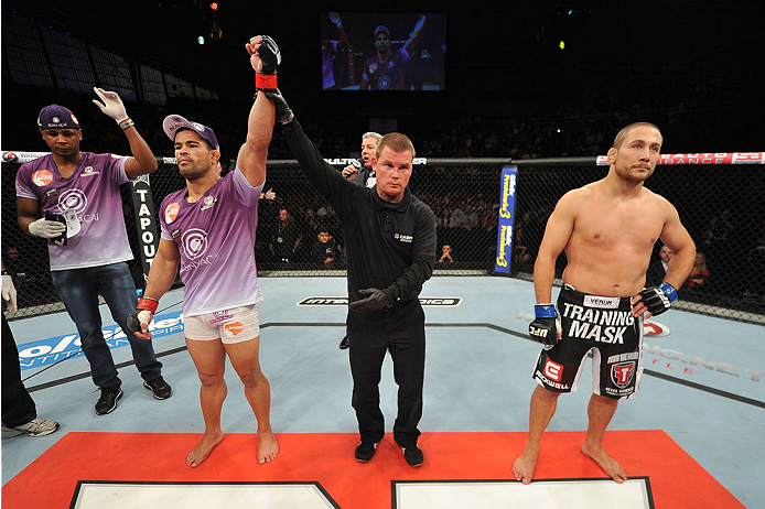 BARUERI, BRAZIL - OCTOBER 9: (L-R) Rousimar Palhares celebrates after defeating Mike Pierce in their welterweight bout during the UFC Fight Night event at the Ginasio Jose Correa on October 9, 2013 in Barueri, Sao Paulo, Brazil. (Photo by Jeff Bottari/Zu