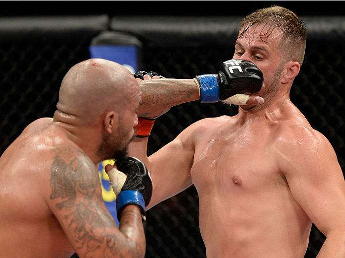 BARUERI, BRAZIL - OCTOBER 9: (L-R) Joey Beltran punches Fabio Maldonado in their light heavyweight bout during the UFC Fight Night event at the Ginasio Jose Correa on October 9, 2013 in Barueri, Sao Paulo, Brazil. (Photo by Jeff Bottari/Zuffa LLC/Zuffa L